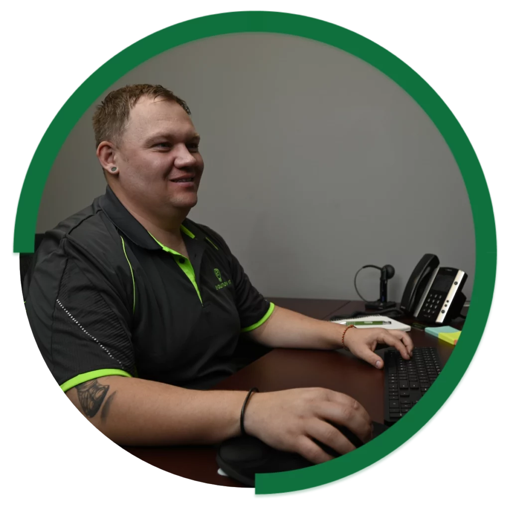 Evolution Group Team Member on computer