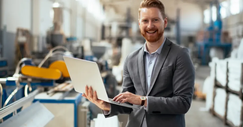 man holding laptop